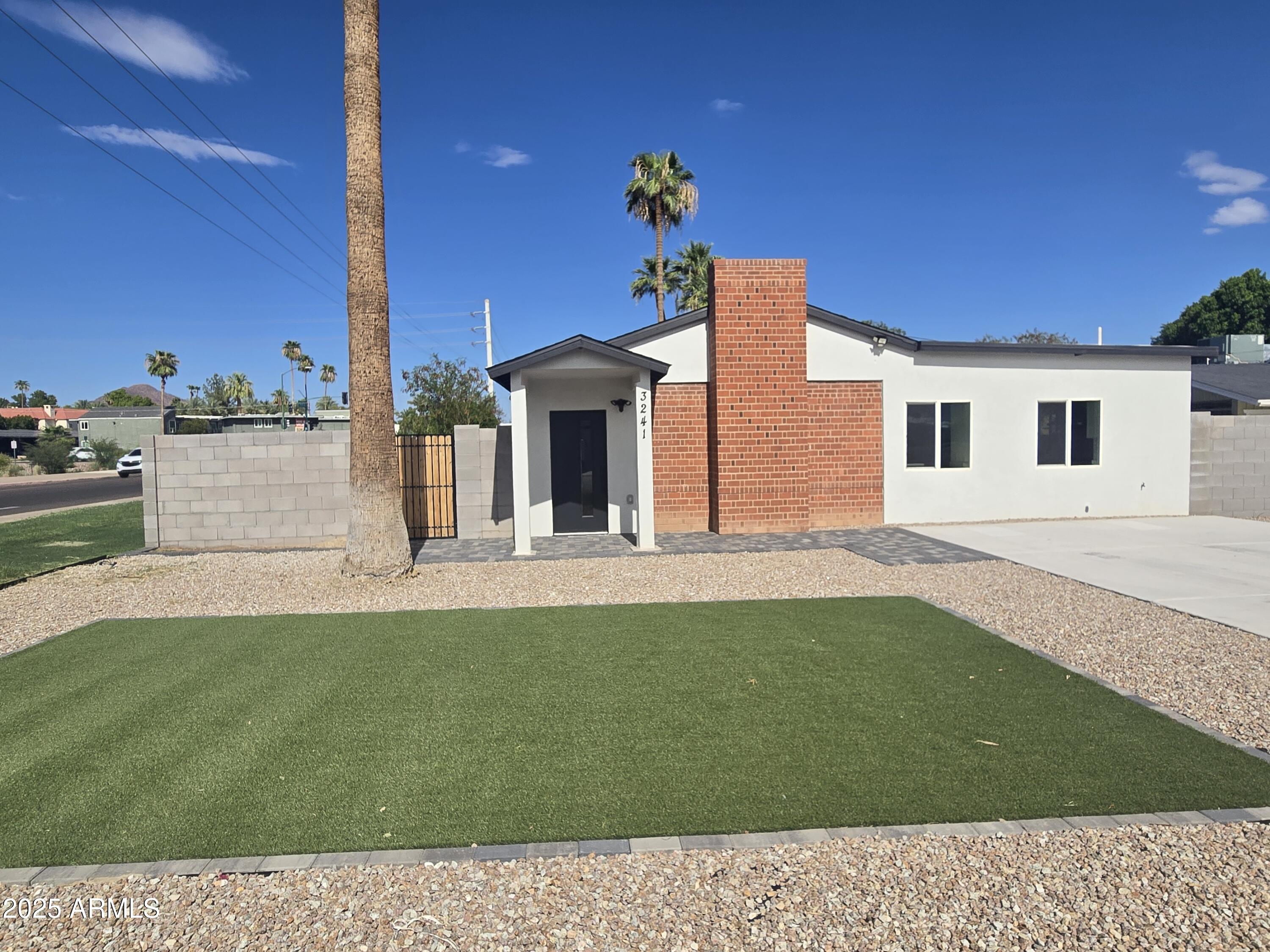 3241 North 27th Place Phoenix, AZ 85016 - Photo 9 of 25 a view of a house with a backyard
