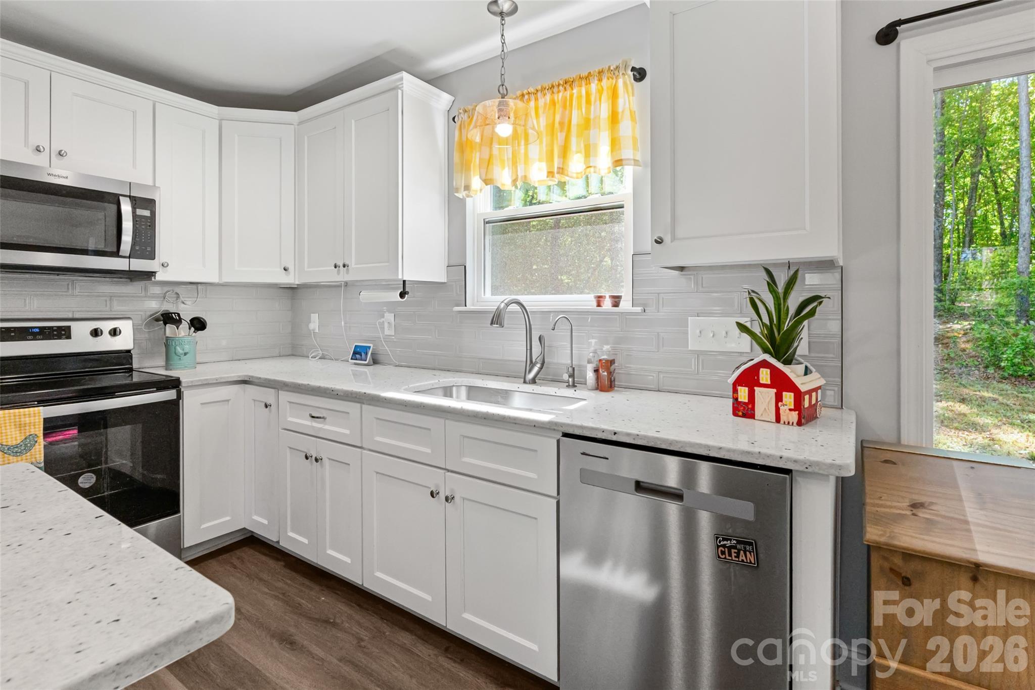 3690 Innes Lane Maiden, NC 28650 - Photo 13 of 34 a kitchen with stainless steel appliances granite countertop a sink and a stove