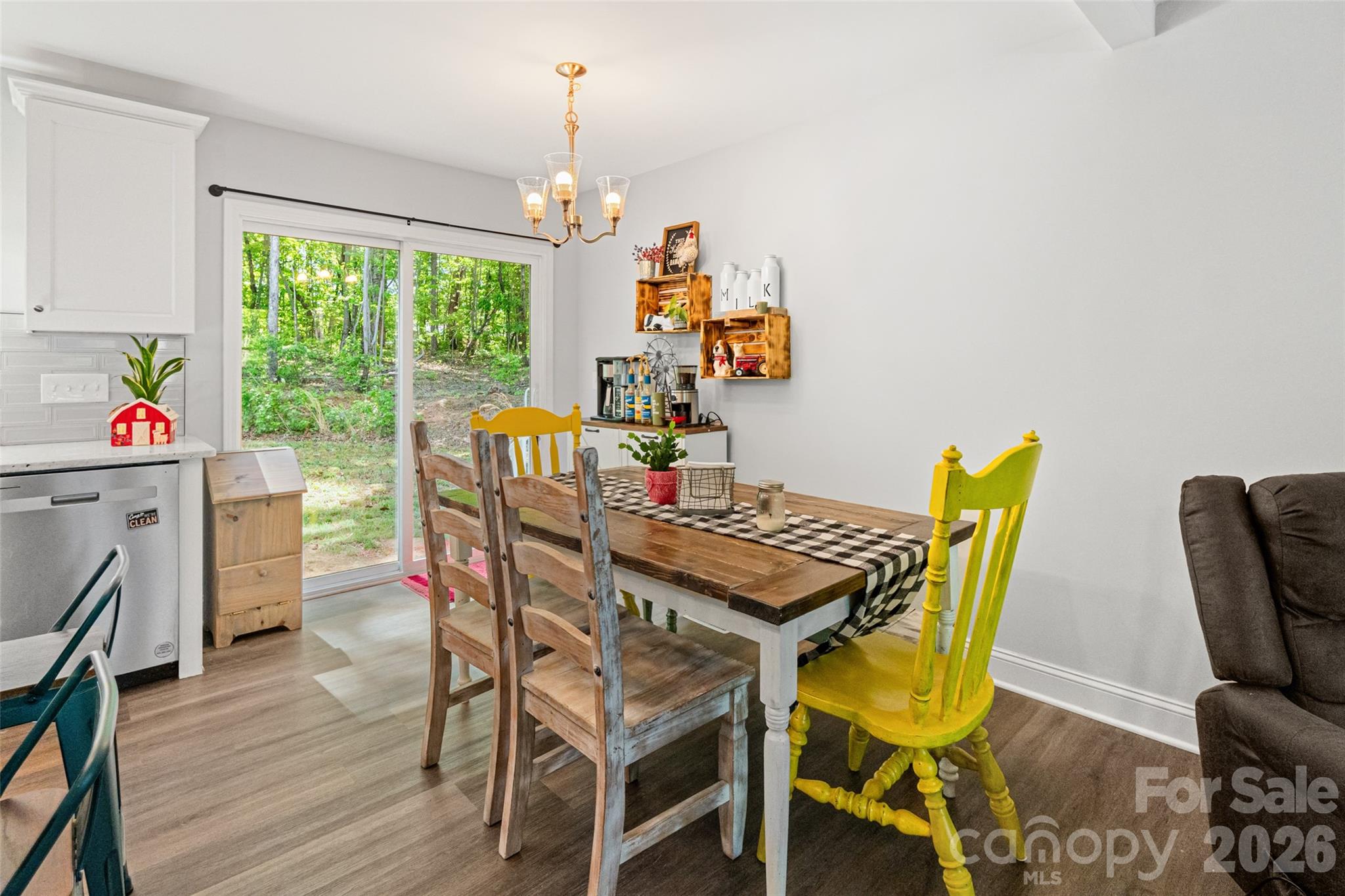 3690 Innes Lane Maiden, NC 28650 - Photo 15 of 34 a view of a dining room with furniture a chandelier and wooden floor