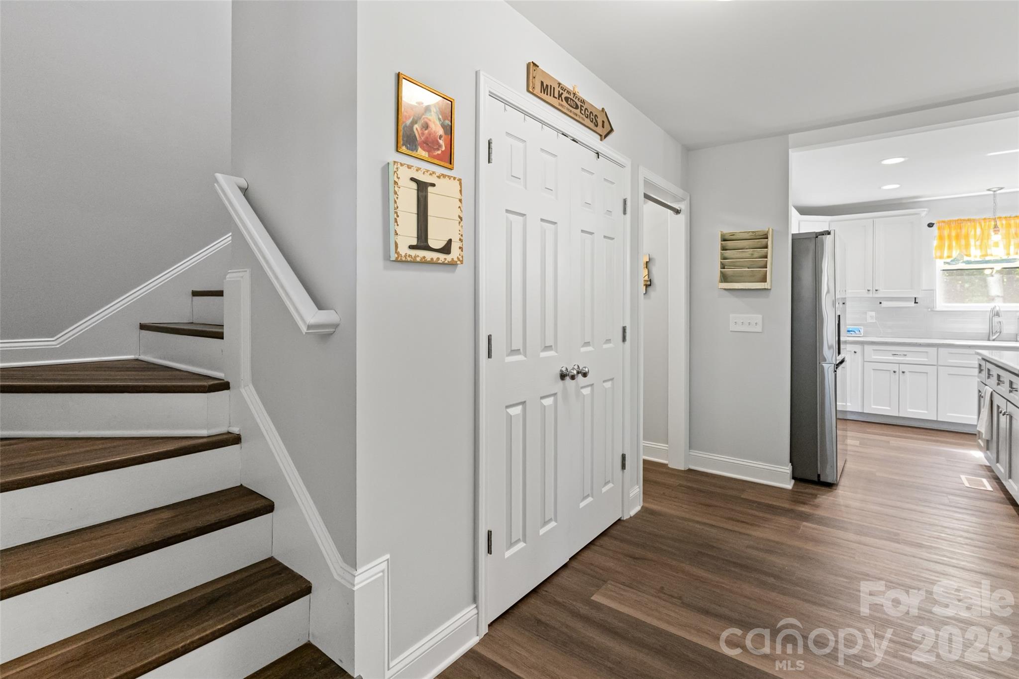 3690 Innes Lane Maiden, NC 28650 - Photo 4 of 34 a view of a hallway with wooden floor and entryway