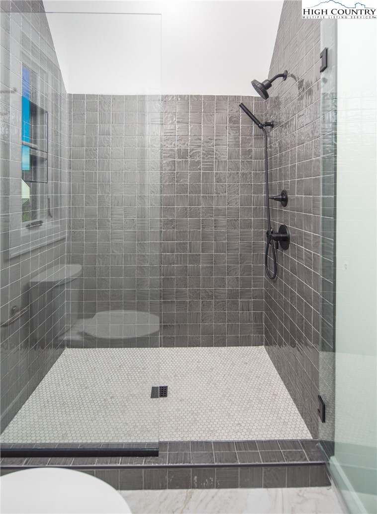 353 Calico Court Boone, NC 28607 - Photo 22 of 50 a bathroom with a shower