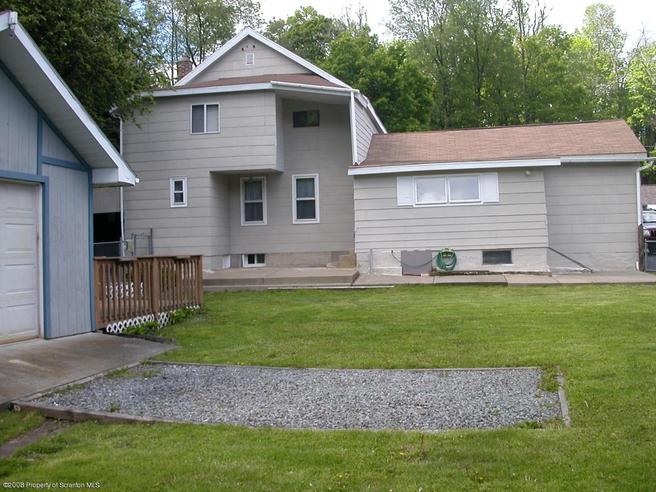 10 Pond Road Moscow, PA 18444 - Photo 1 of 11 a front view of a house with a yard