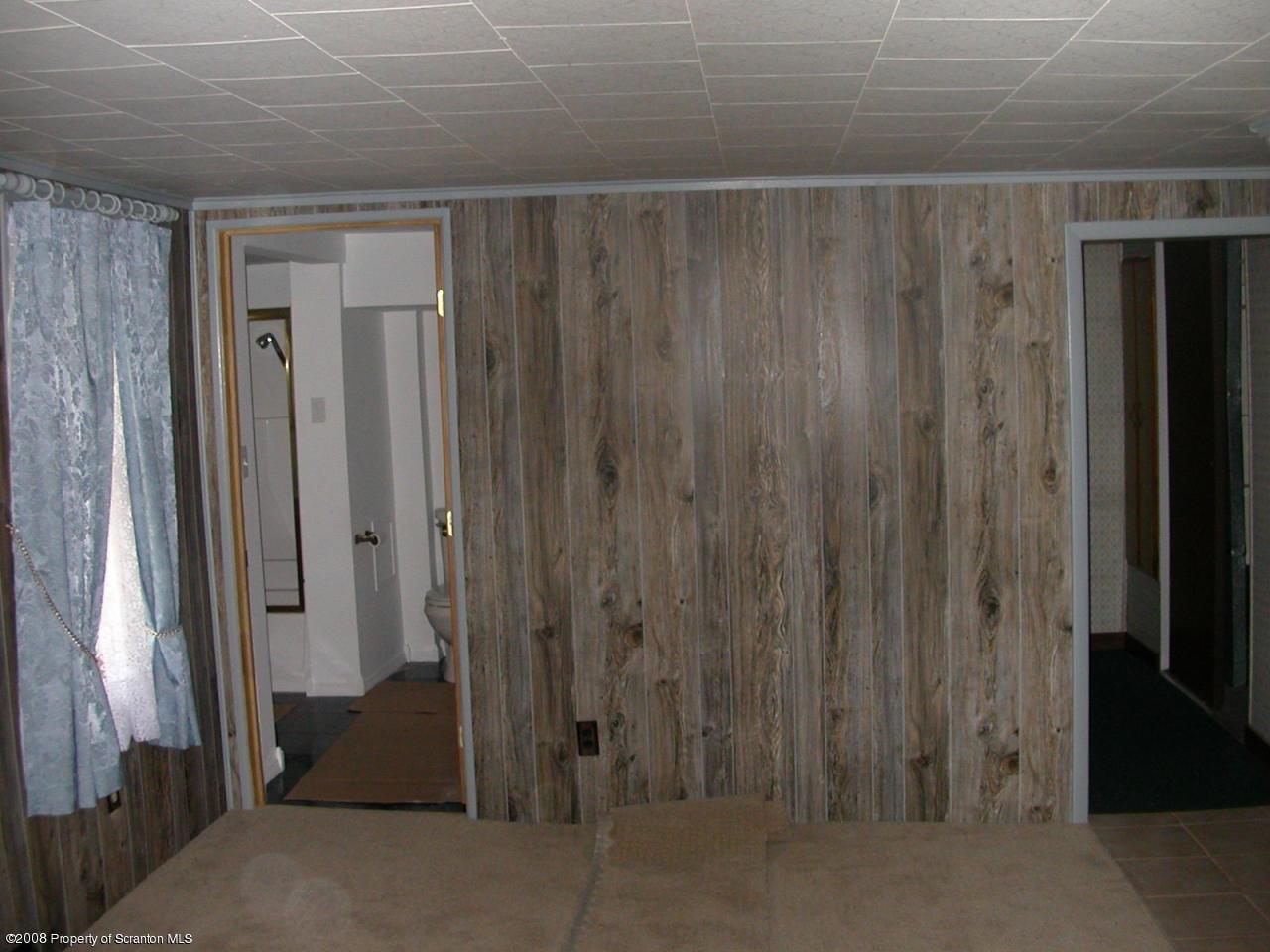 10 Pond Road Moscow, PA 18444 - Photo 6 of 11 a view of a hallway with wooden shelves