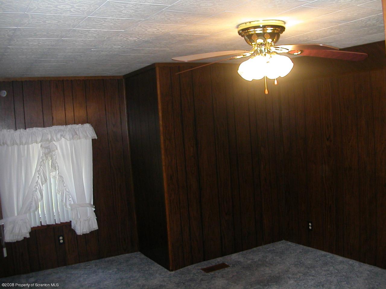 10 Pond Road Moscow, PA 18444 - Photo 8 of 11 a view of dining room with a chandelier