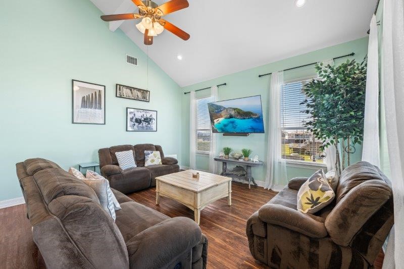 343 Jettyview Road Freeport, TX 77541 - Photo 16 of 44 a living room with furniture a chandelier and a window