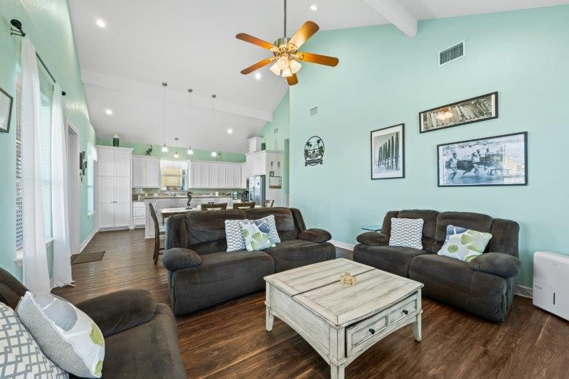 343 Jettyview Road Freeport, TX 77541 - Photo 17 of 44 a living room with furniture and a chandelier