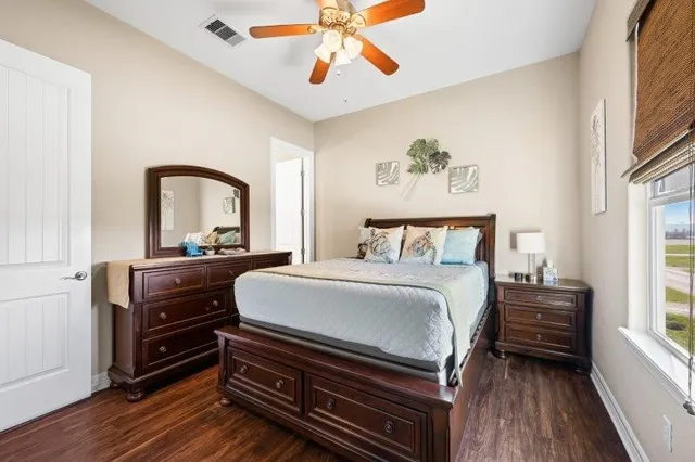 a bedroom with a bed and a dresser