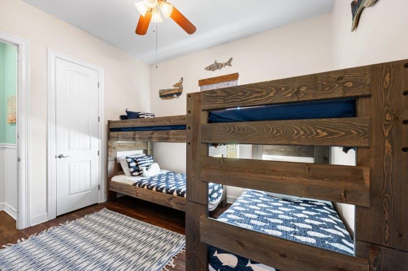 343 Jettyview Road Freeport, TX 77541 - Photo 30 of 44 a bedroom with a bed and a window