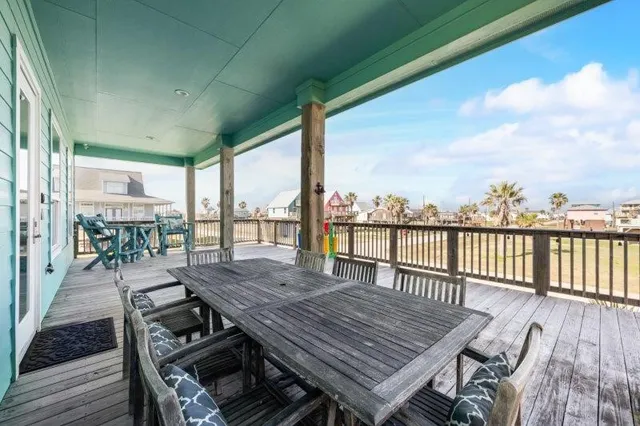 a view of a balcony with wooden floor