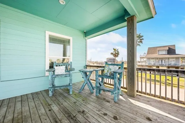 a view of a balcony with chairs