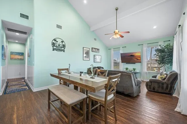 a view of a livingroom with furniture window and wooden floor