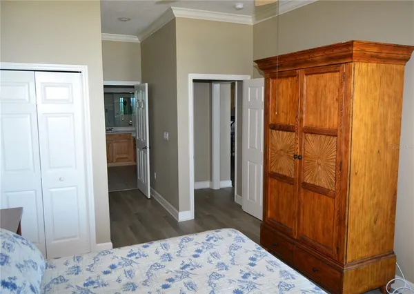 a bedroom with a bed and a dresser