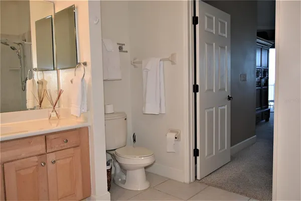 a bathroom with a toilet sink and shower