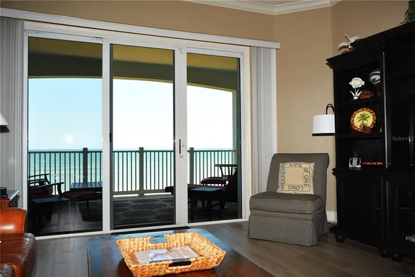 a view of a porch with a floor to ceiling window stairs