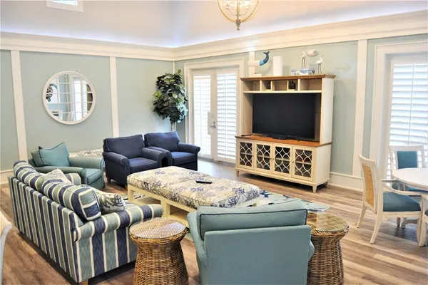a living room with a pool table and a window