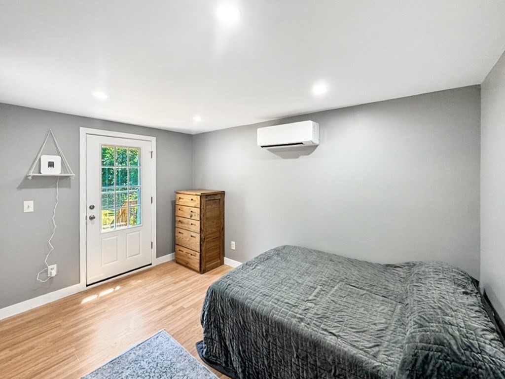 3 Maple Ridge Road, Unit 3 Seabrook, NH 03874 - Photo 11 of 26 a bedroom with a bed and a window