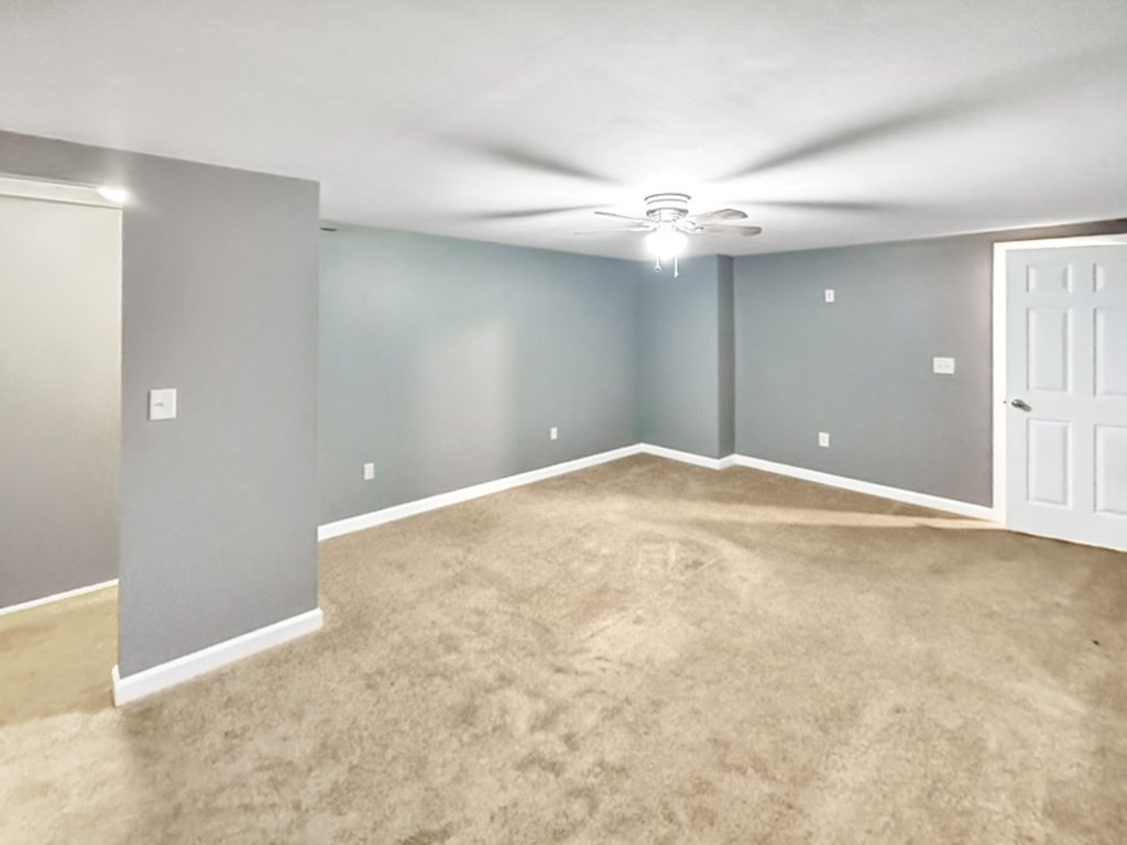3 Maple Ridge Road, Unit 3 Seabrook, NH 03874 - Photo 20 of 26 a view of an empty room with a ceiling fan