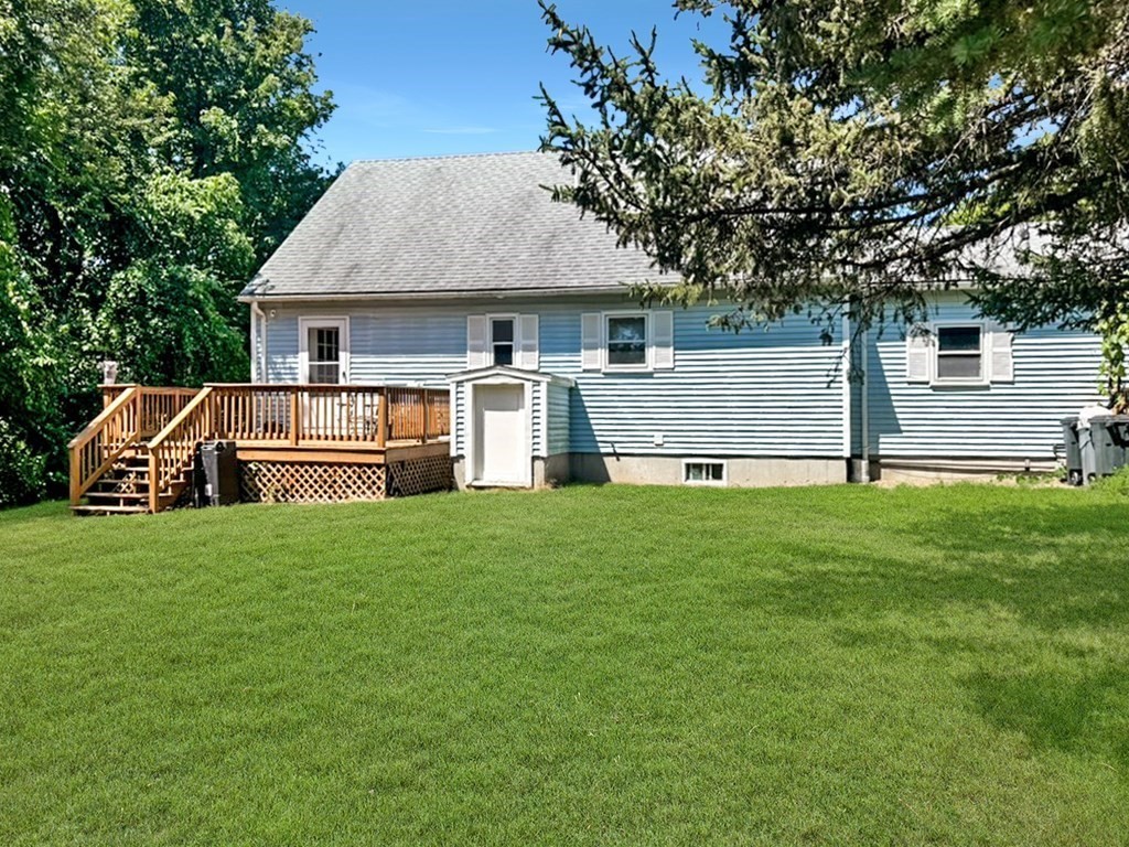 3 Maple Ridge Road, Unit 3 Seabrook, NH 03874 - Photo 4 of 26 a front view of a house with a yard
