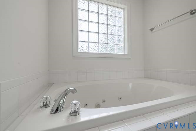 6118 Springwood Road Chester, VA 23831 - Photo 29 of 38 Built-in jetted tub with chrome fixtures and clear