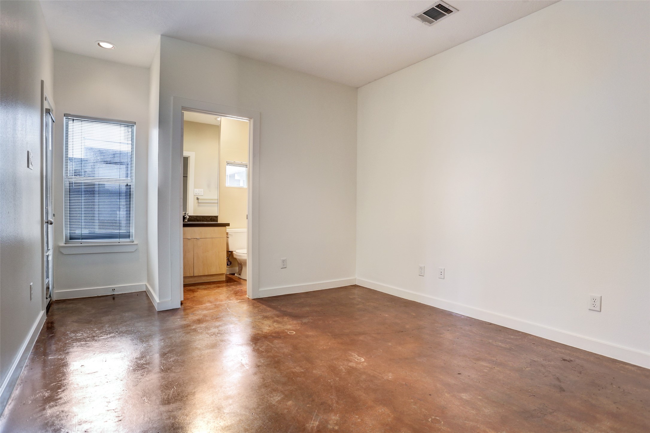 5443 Rose Street Houston, TX 77007 - Photo 11 of 32 an empty room with wooden floor and entrance