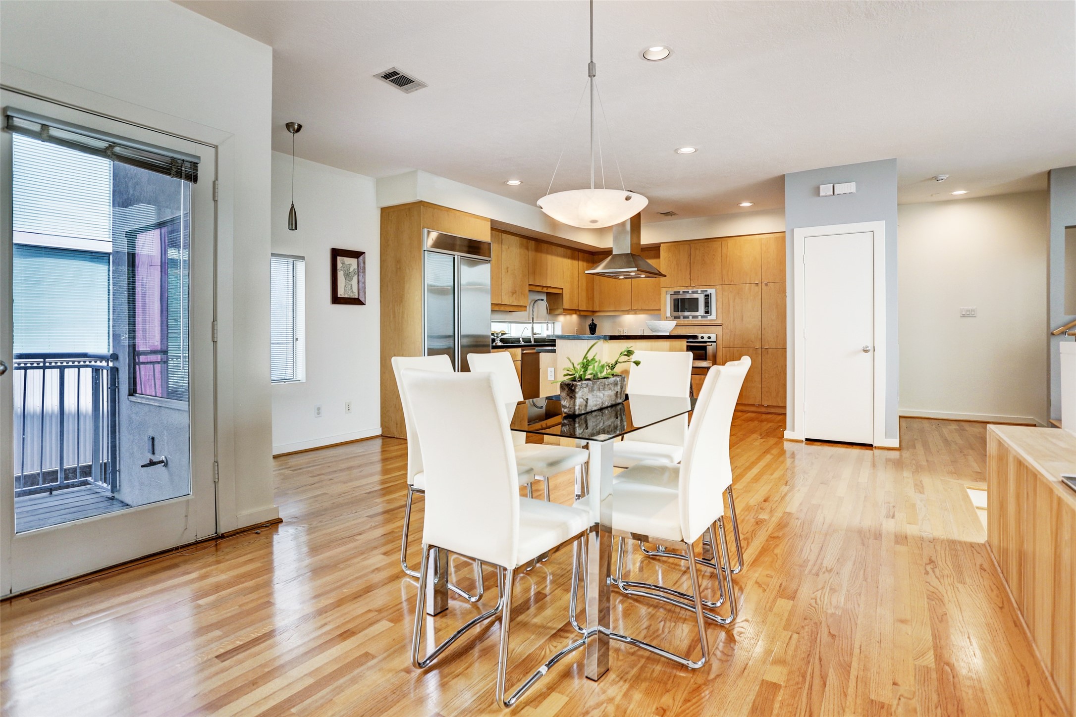 5443 Rose Street Houston, TX 77007 - Photo 15 of 32 a view of a dining room with furniture and wooden floor