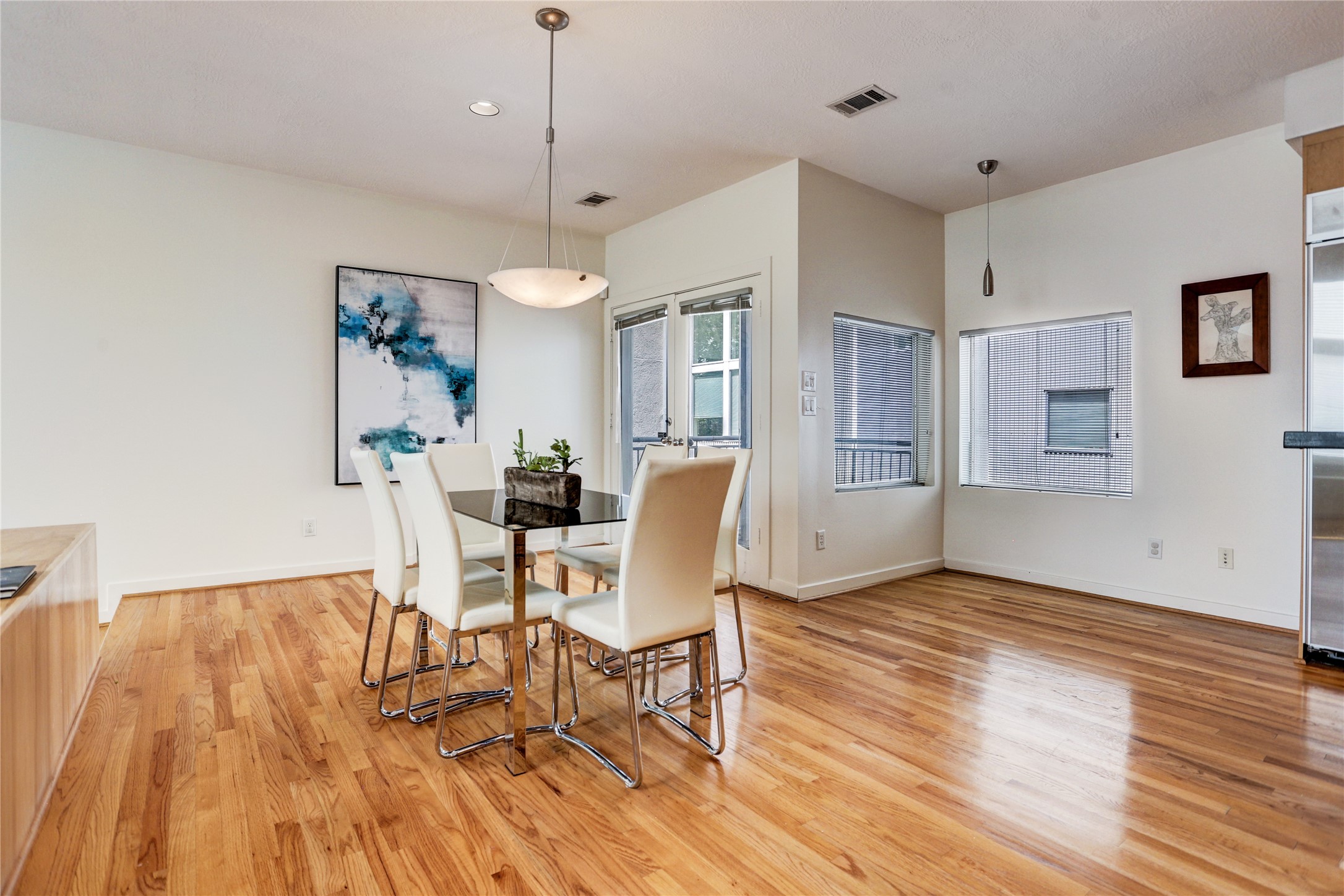 5443 Rose Street Houston, TX 77007 - Photo 18 of 32 a view of a dining room with furniture a rug and wooden floor
