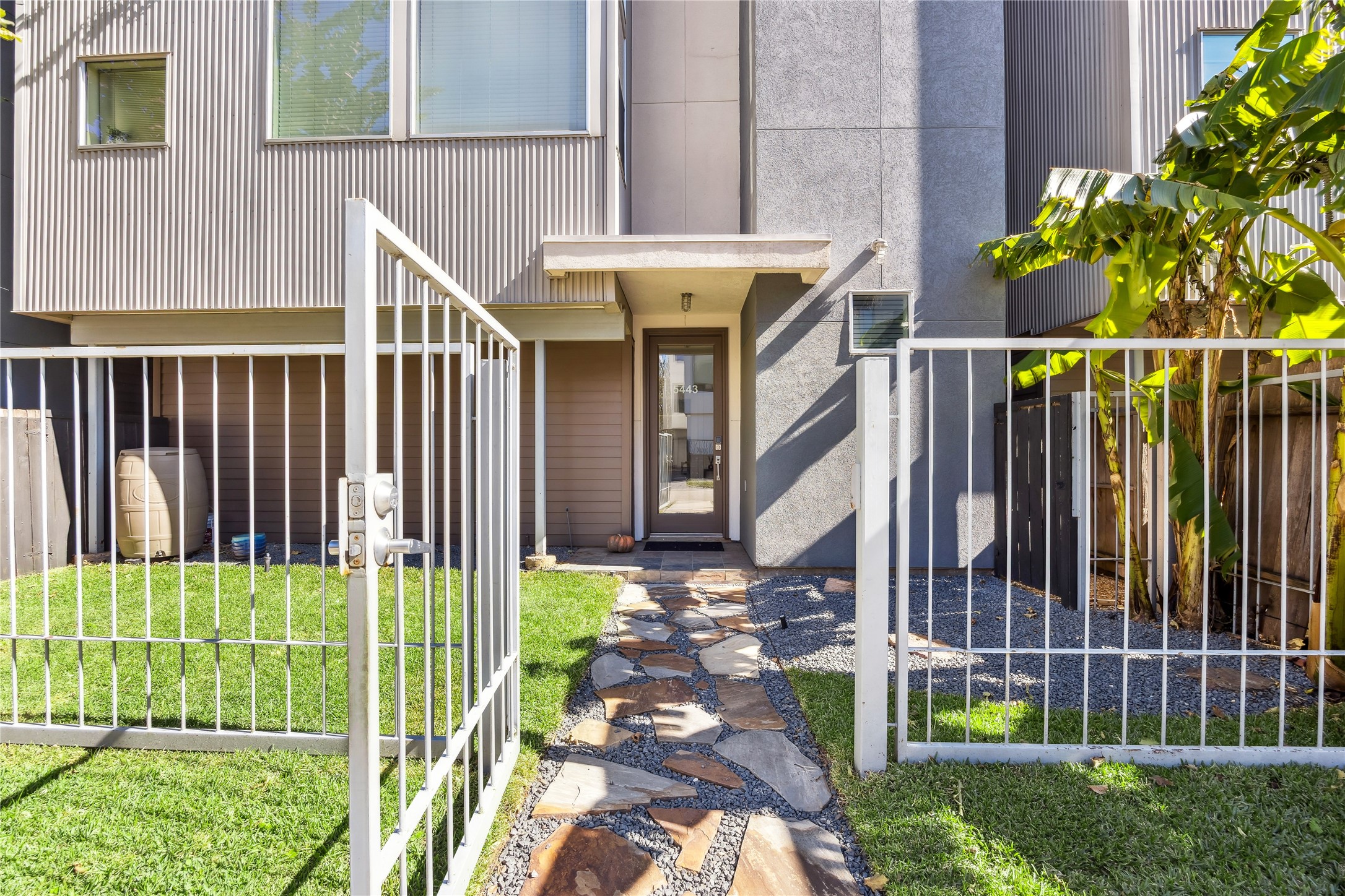 5443 Rose Street Houston, TX 77007 - Photo 2 of 32 a view of a house with a small yard and plants