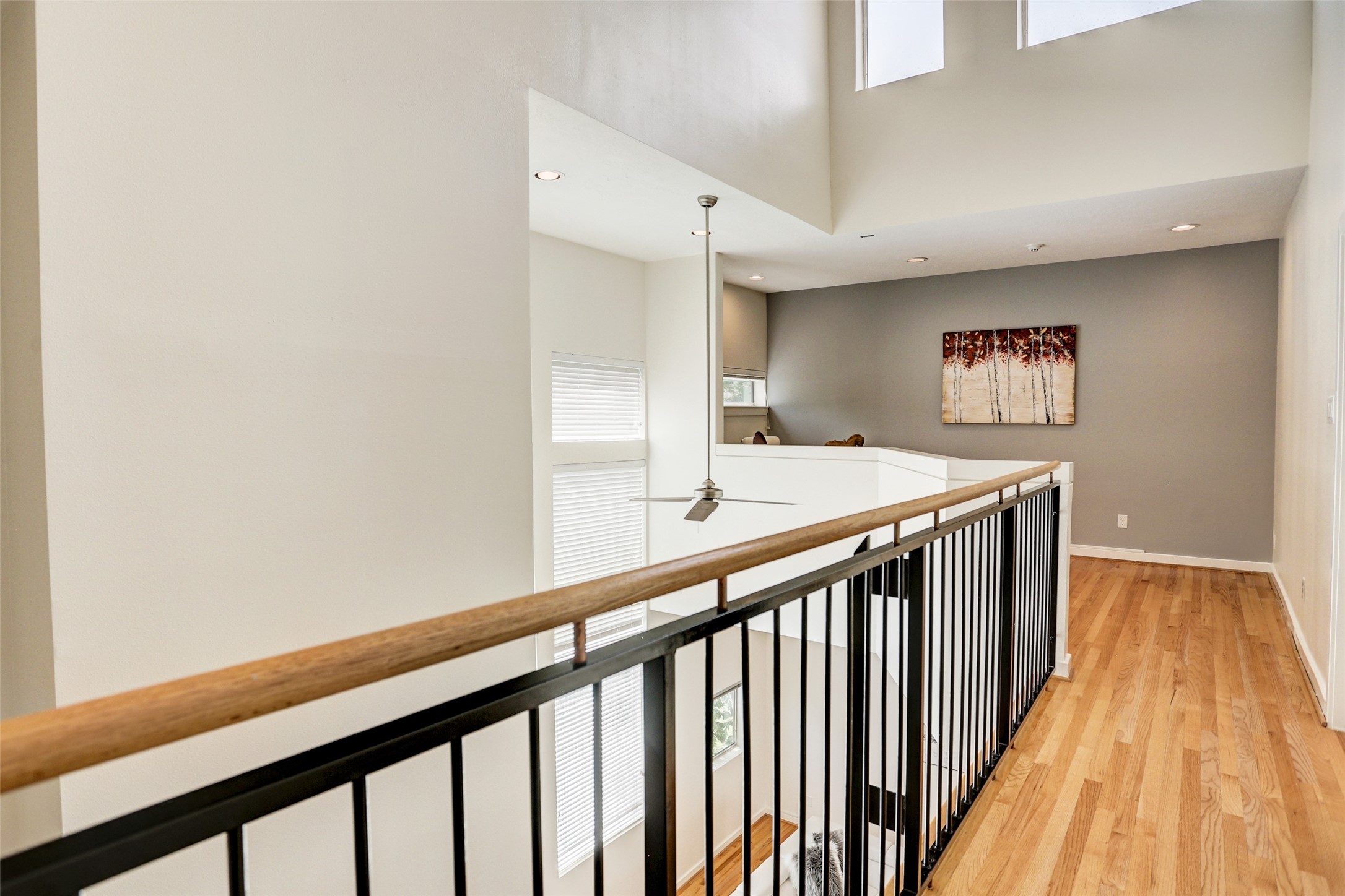 5443 Rose Street Houston, TX 77007 - Photo 23 of 32 a view of a hallway with wooden floor