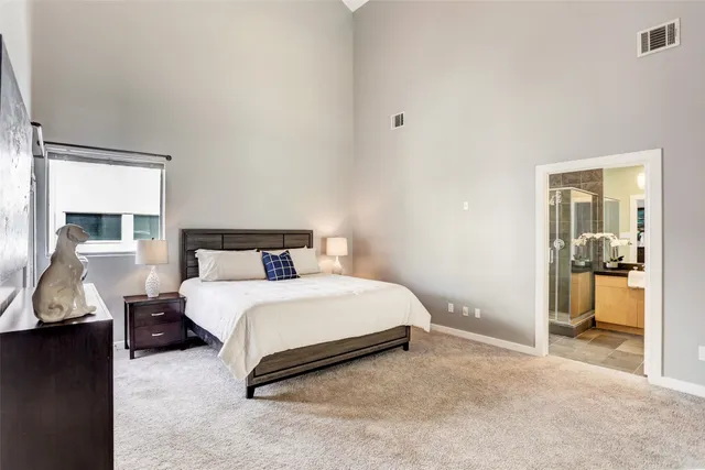 a bedroom with a bed and a walk in closet