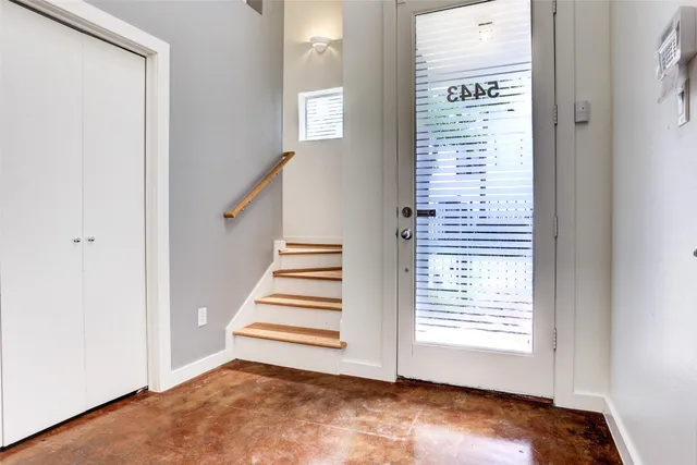 a view of an empty room with stairs