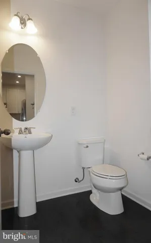 a bathroom with a toilet and a sink