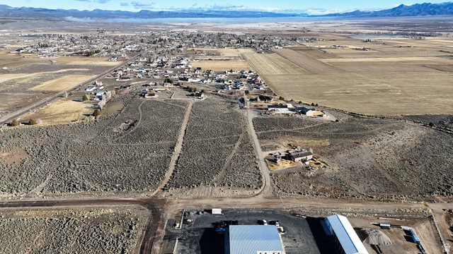 230 East D D Holw Road Panguitch, UT 84759 - Photo 4 of 37 Aerial view of property and surrounding area featuring rural landscape and a mountain backdrop