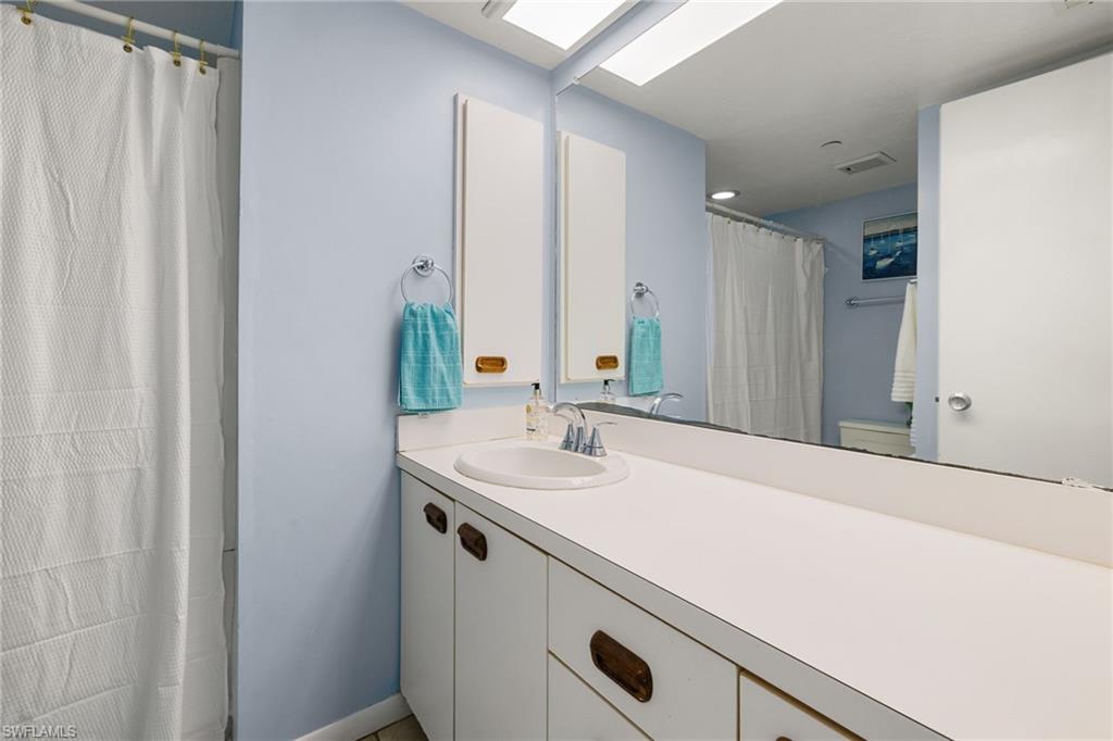 7070 Placida Road, Unit 1212 Placida, FL 33946 - Photo 18 of 36 Full Bathroom with Tub & Shower
