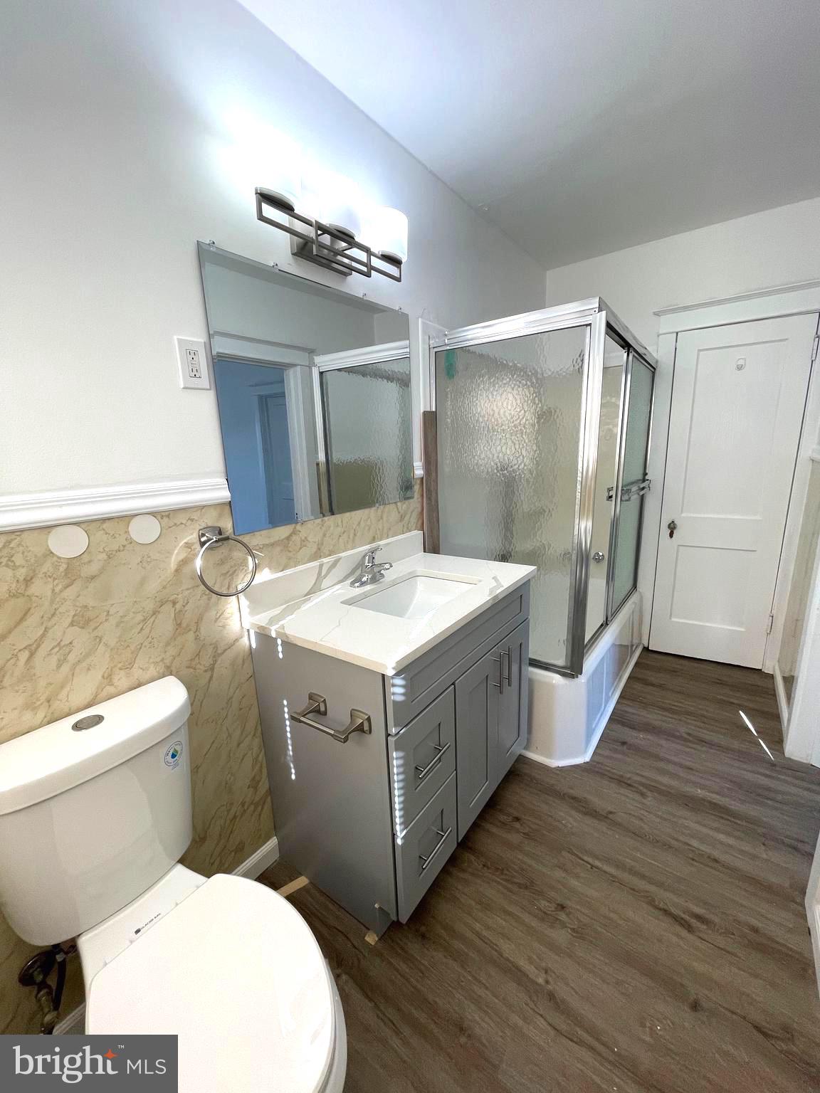 319 Simms Street, Unit 2 Philadelphia, PA 19116 - Photo 18 of 23 a bathroom with a sink and mirror