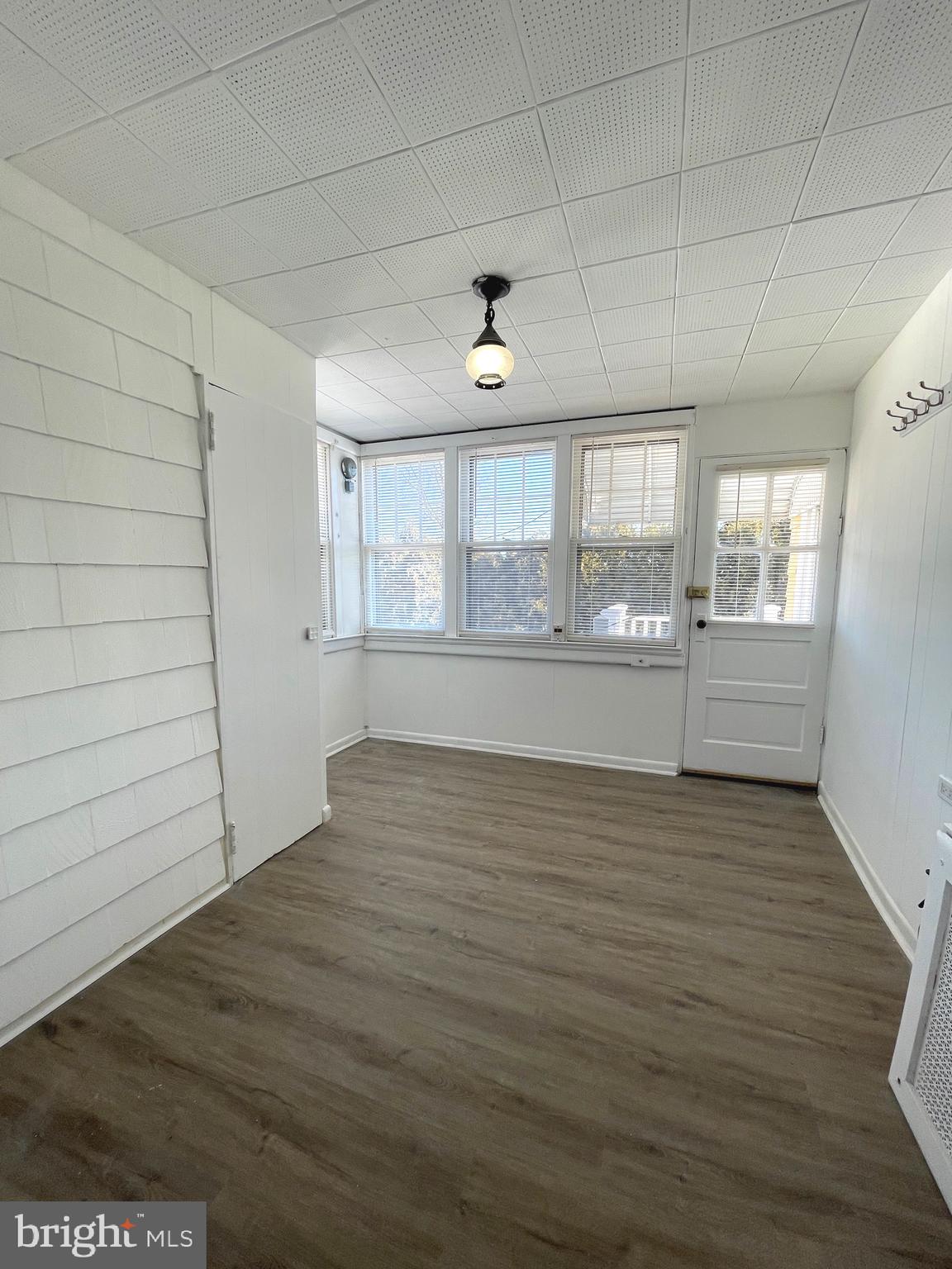 319 Simms Street, Unit 2 Philadelphia, PA 19116 - Photo 8 of 23 an empty room with wooden floor and windows