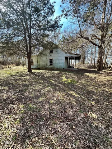 a house with a tree in front of it