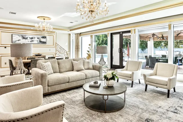 a view of a dining room with furniture wooden floor and chandelier