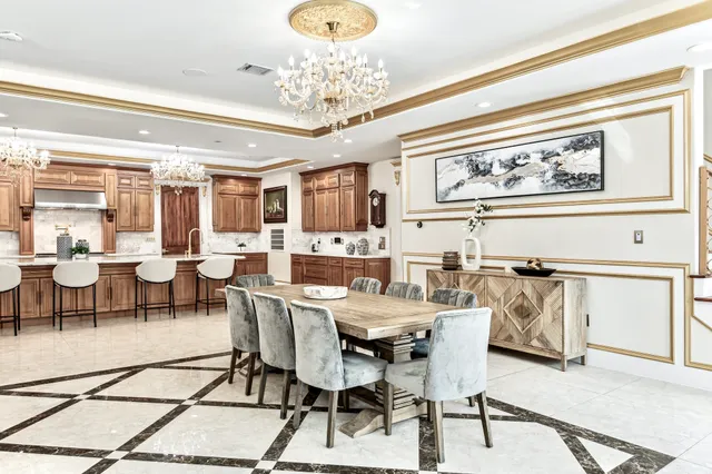 an aerial view of a house with swimming pool garden and patio