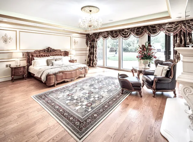 a large spacious bathroom with a granite countertop sink a large mirror and a bathtub