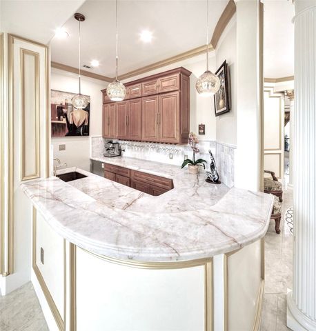 a bathroom with a granite countertop sink a mirror and vanity