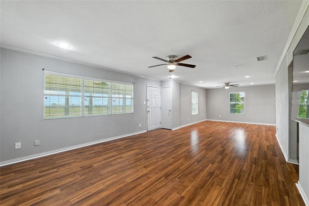 358 Wright Road Waxahachie, TX 75167 - Photo 17 of 38 a view of empty room with wooden floor and fan