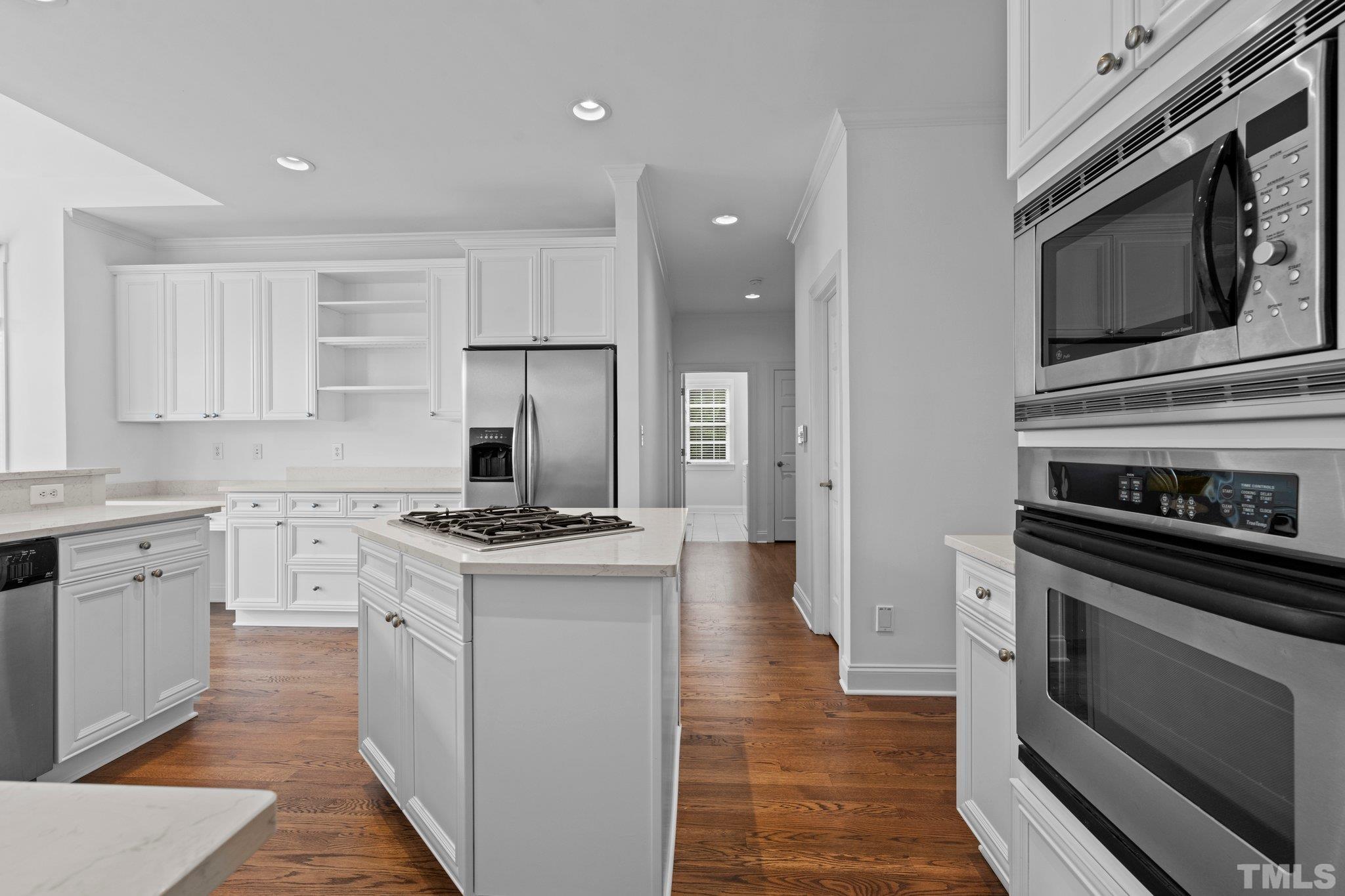 4800 Patton Ridge Court Raleigh, NC 27612 - Photo 12 of 61 a kitchen with a stove and a microwave
