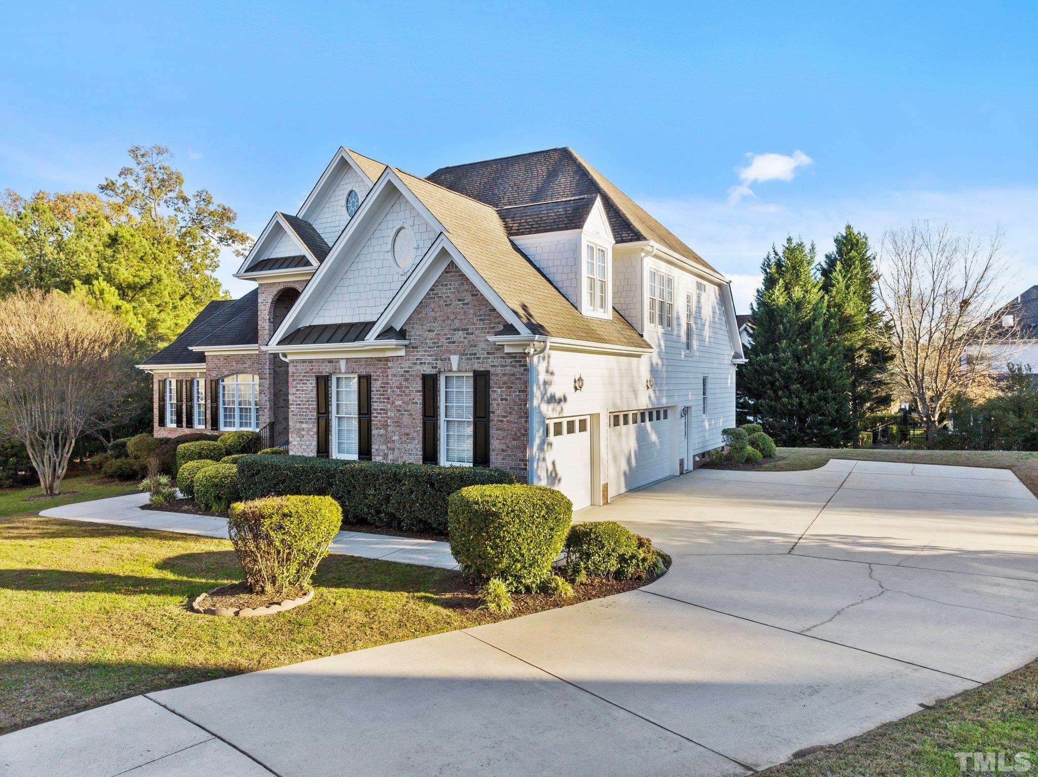 4800 Patton Ridge Court Raleigh, NC 27612 - Photo 16 of 61 a front view of house with yard and trees around