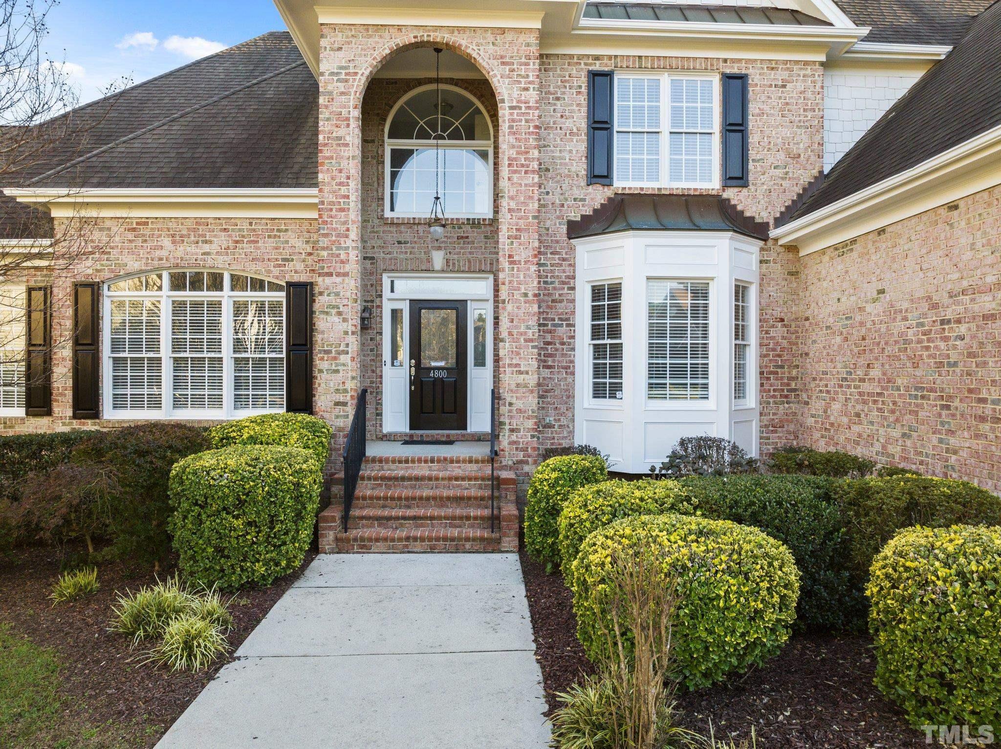 4800 Patton Ridge Court Raleigh, NC 27612 - Photo 31 of 61 a view of a brick house with large windows