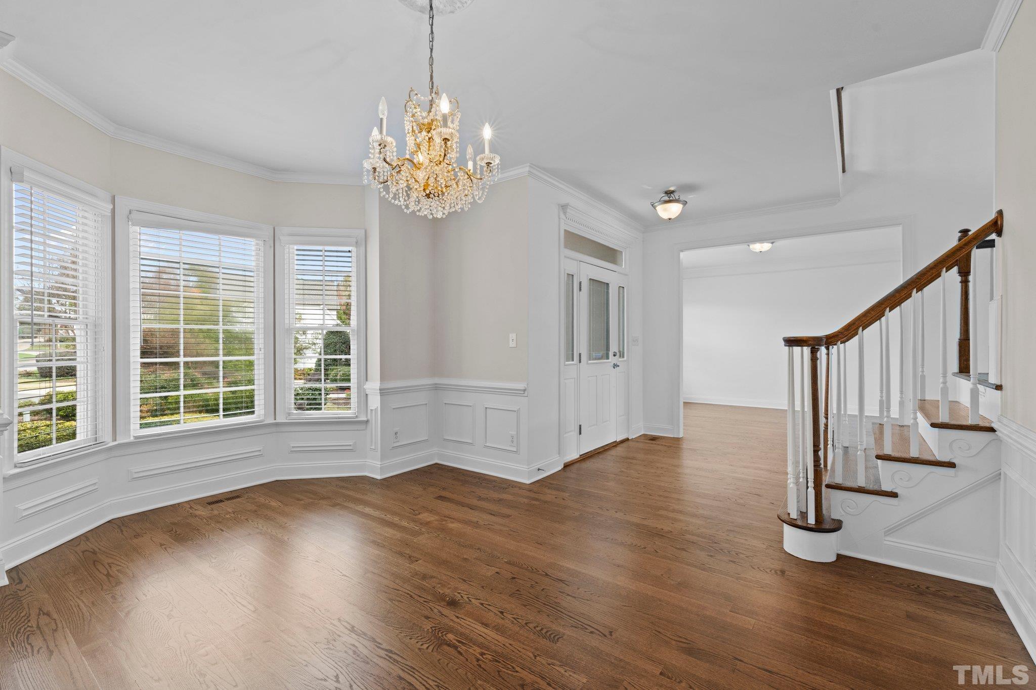 4800 Patton Ridge Court Raleigh, NC 27612 - Photo 35 of 61 a view of an empty room with wooden floor and a window