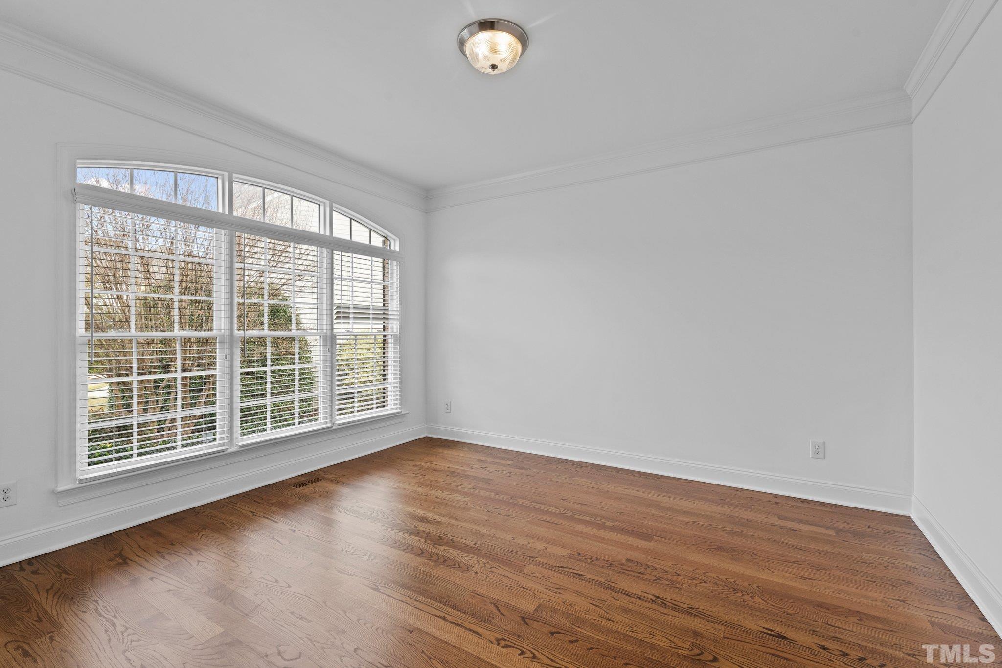 4800 Patton Ridge Court Raleigh, NC 27612 - Photo 36 of 61 a view of a livingroom with wooden floor and window