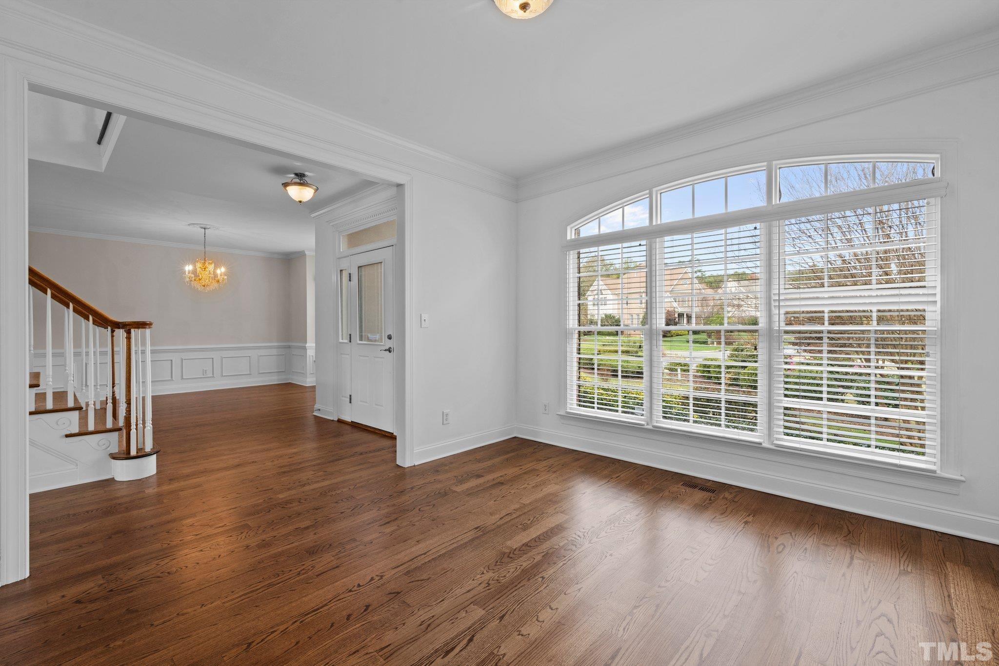 4800 Patton Ridge Court Raleigh, NC 27612 - Photo 37 of 61 a view of empty room with wooden floor and fan
