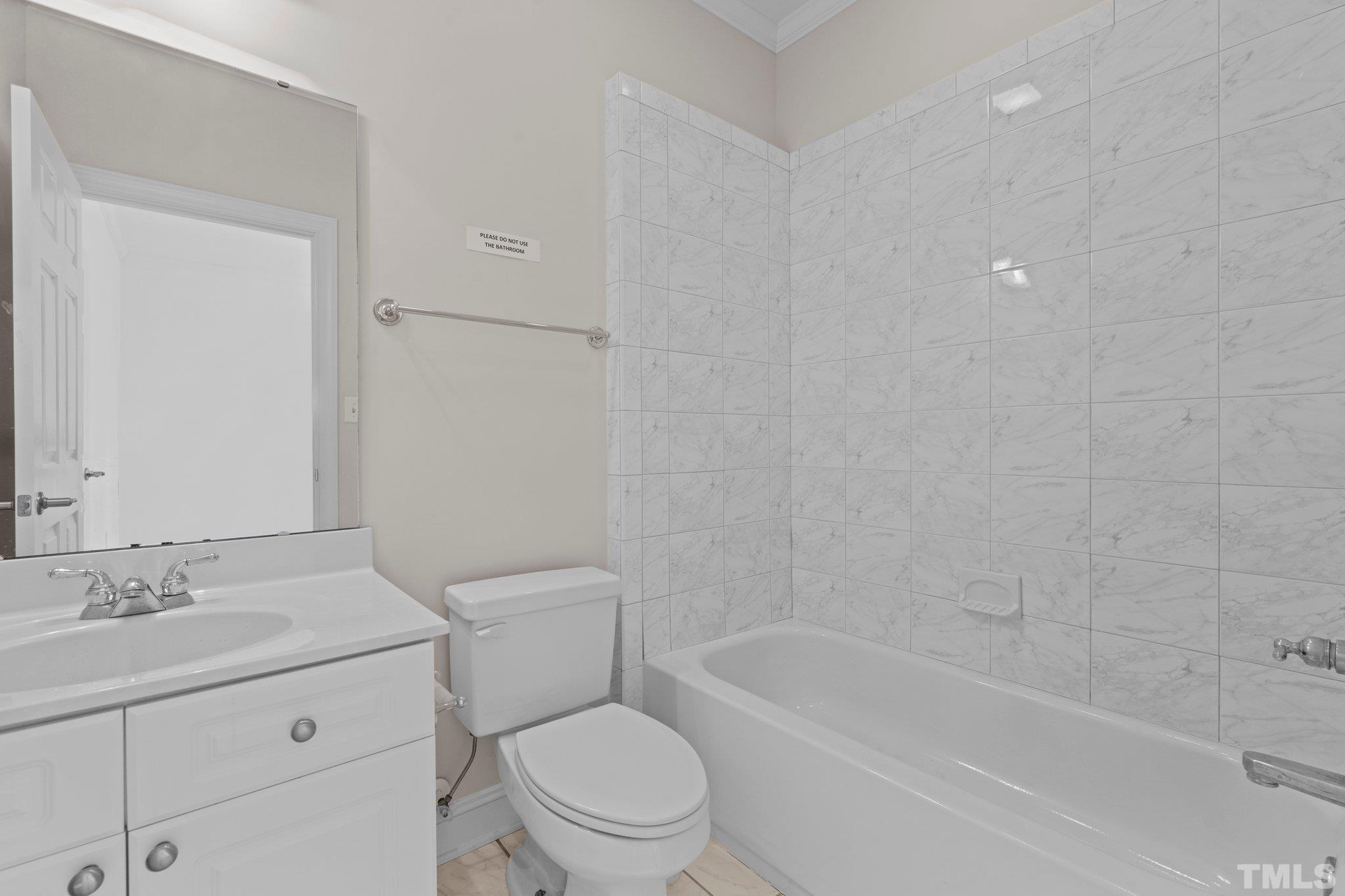 4800 Patton Ridge Court Raleigh, NC 27612 - Photo 46 of 61 a bathroom with a granite countertop sink a toilet and shower