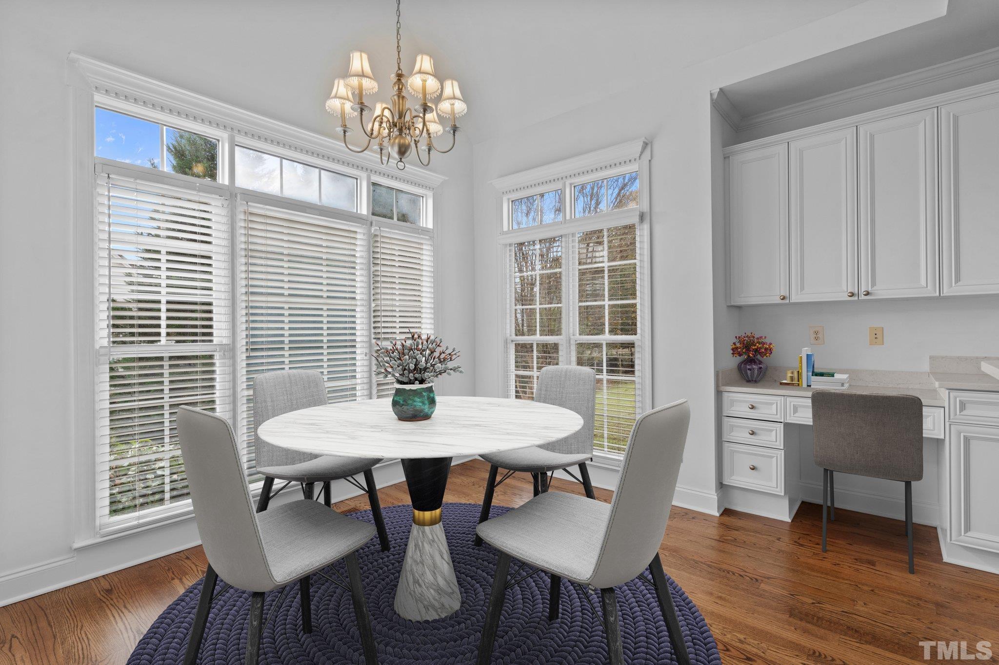 4800 Patton Ridge Court Raleigh, NC 27612 - Photo 5 of 61 a view of a dining room with furniture window and wooden floor