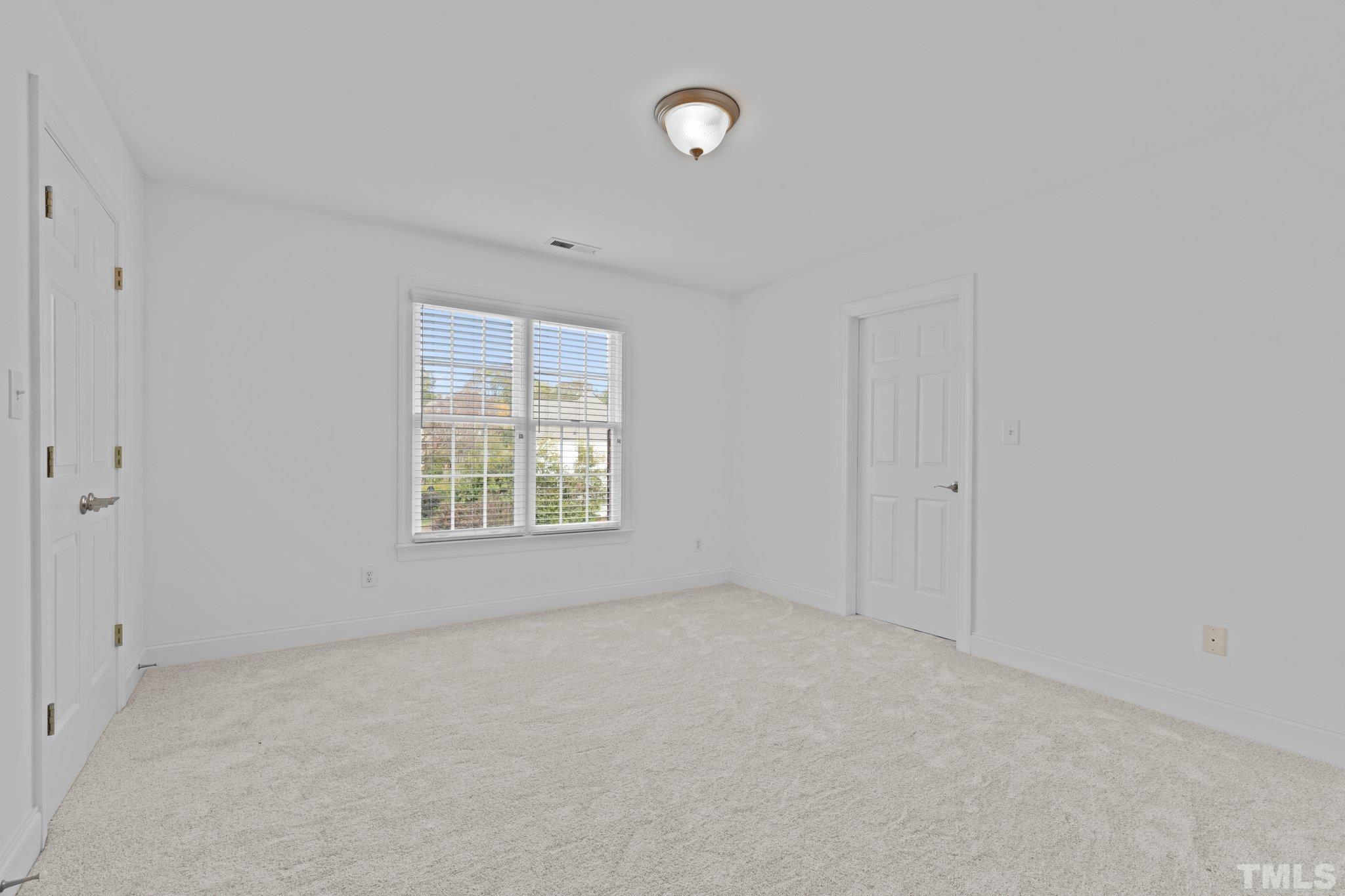 4800 Patton Ridge Court Raleigh, NC 27612 - Photo 54 of 61 a view of an empty room with a window